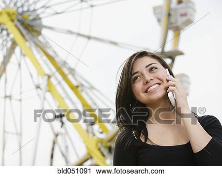 Mixed Race girl talking on cell phone View Large Photo Image Stock Image - Mixed Race girl talking on cell phone. Fotosearch