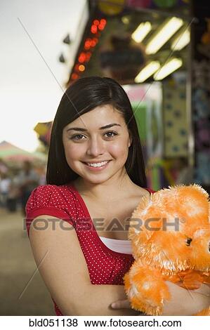Mixed Race teenaged girl at carnival View Large Photo Image Stock Photo - Mixed Race teenaged girl at carnival . Fotosearch