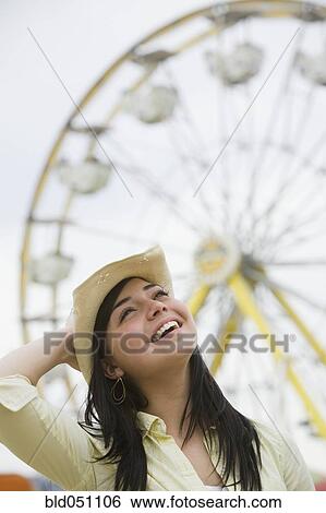 Stock Photograph - Mixed Race teenaged girl at carnival. Fotosearch
