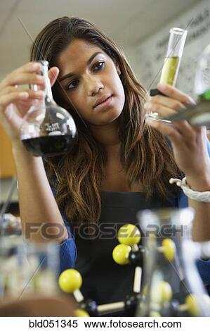Stock Photography - Mixed Race teenaged girl in science class. Fotosearch