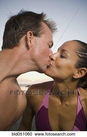 Multi-ethnic couple kissing View Large Photo Image Stock Image - Multi-ethnic couple kissing. Fotosearch