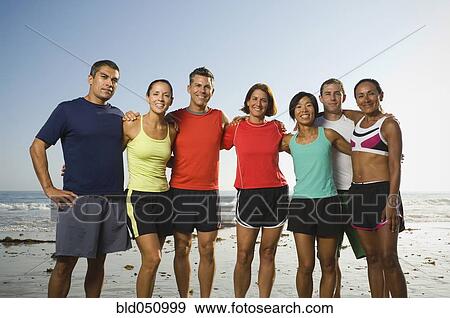 Stock Photo - Multi-ethnic runners at beach. Fotosearch
