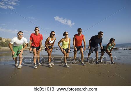 Multi-ethnic runners racing at beach View Large Photo Image Stock Image - Multi-ethnic runners racing at beach. Fotosearch
