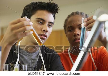 Multi-ethnic teenaged boys in science class View Large Photo Image Stock Photo - Multi-ethnic teenaged boys in science class. Fotosearch