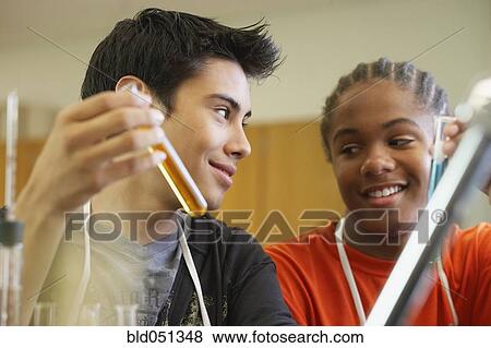 Multi-ethnic teenaged boys in science class View Large Photo Image Stock Photo - Multi-ethnic teenaged boys in science class. Fotosearch