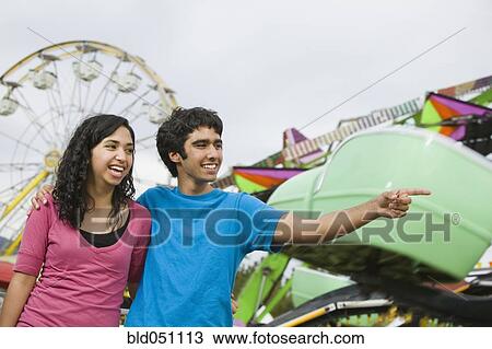 Multi-ethnic teenaged couple at carnival View Large Photo Image Stock Image - Multi-ethnic teenaged couple at carnival. Fotosearch