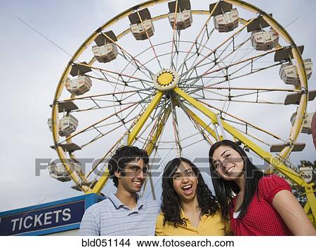 Picture - Multi-ethnic teenaged friends at carnival. Fotosearch
