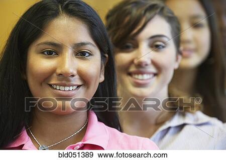Multi-ethnic teenaged girls in row View Large Photo Image Stock Photo - Multi-ethnic teenaged girls in row. Fotosearch