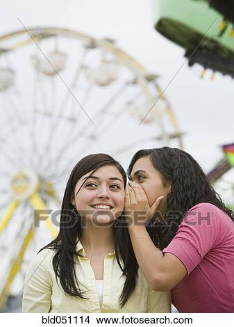 Multi-ethnic teenaged girls telling secret View Large Photo Image Picture - Multi-ethnic teenaged girls telling secret. Fotosearch
