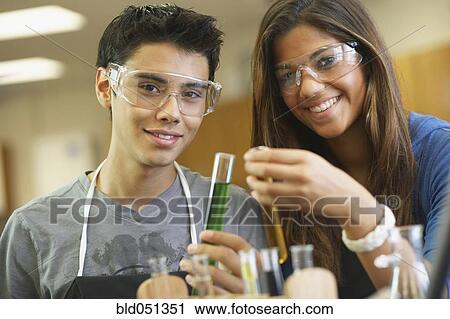 Stock Image - Multi-ethnic teenagers in science class. Fotosearch