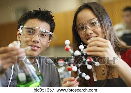 Stock Photo - Multi-ethnic teenagers in science class. Fotosearch
