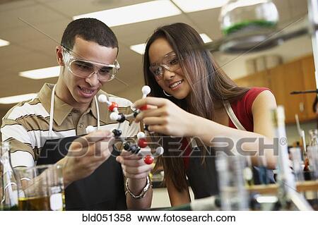 Stock Photo - Multi-ethnic teenagers in science class. Fotosearch