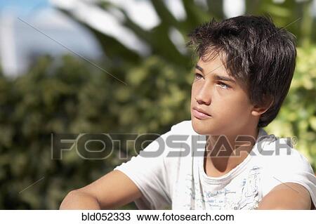 Pacific Islander boy sitting outdoors View Large Photo Image Stock Image - Pacific Islander boy sitting outdoors. Fotosearch