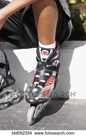 Pacific Islander boy wearing roller blades View Large Photo Image Picture - Pacific Islander boy wearing roller blades. Fotosearch