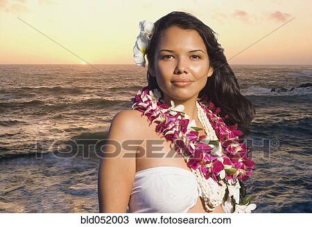 Stock Image - Pacific Islander woman wearing lei. Fotosearch
