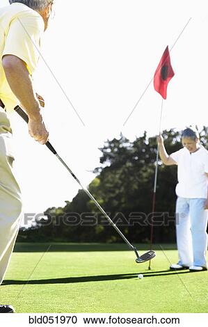 Senior Asian couple playing golf View Large Photo Image Stock Image - Senior Asian couple playing golf. Fotosearch