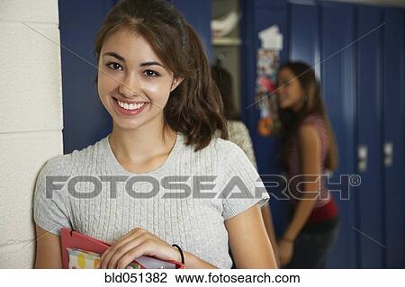 Teenaged girl in front of school lockers View Large Photo Image Stock Image - Teenaged girl in front of school lockers. Fotosearch