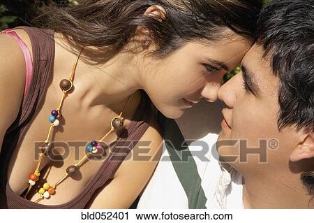 Young Hispanic couple touching noses View Large Photo Image Stock Image - Young Hispanic couple touching noses. Fotosearch