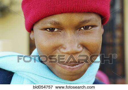 Stock Photo - African boy wearing winter hat and scarf. Fotosearch