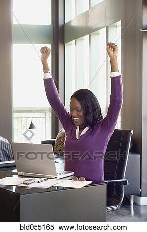 African businesswoman cheering View Large Photo Image Stock Photography - African businesswoman cheering. Fotosearch