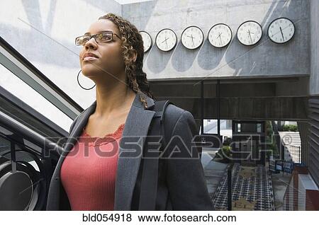 Stock Photo - African businesswoman in train station. Fotosearch