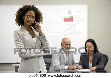 Stock Photography - African businesswoman talking on cell phone. Fotosearch
