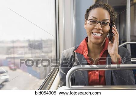 Stock Photography - African businesswoman talking on cell phone. Fotosearch