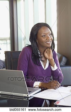 African businesswoman working at home View Large Photo Image Stock Image - African businesswoman working at home. Fotosearch