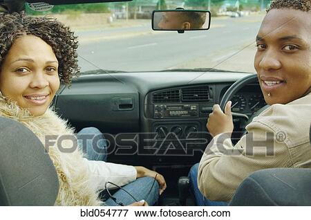 African couple driving in convertible car View Large Photo Image Stock Photo - African couple driving in convertible car. Fotosearch