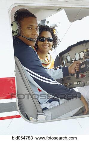 African couple in cockpit of airplane View Large Photo Image Stock Image - African couple in cockpit of airplane. Fotosearch