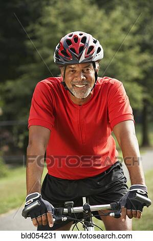 African man riding bicycle View Large Photo Image Stock Image - African man riding bicycle. Fotosearch