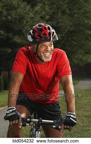 African man riding bicycle View Large Photo Image Stock Image - African man riding bicycle. Fotosearch