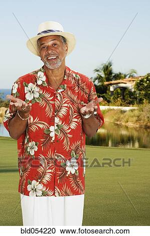 Stock Image - African man wearing Hawaiian shirt. Fotosearch