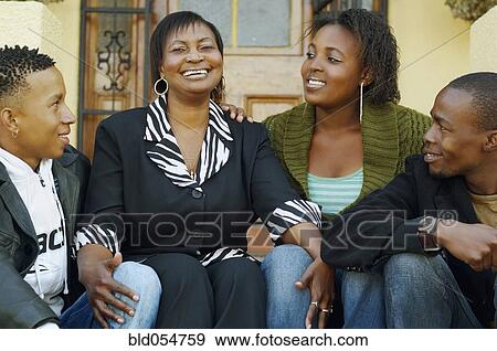 African mother and adult children on porch steps View Large Photo Image Stock Photo - African mother and adult children on porch steps. Fotosearch