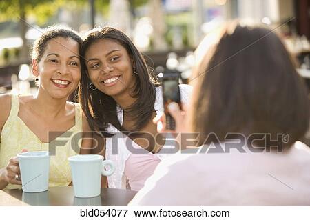 African mother and daughter having photograph taken View Large Photo Image Stock Photo - African mother and daughter having photograph taken. Fotosearch
