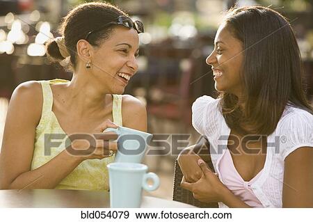 African mother and daughter laughing View Large Photo Image Stock Photo - African mother and daughter laughing. Fotosearch