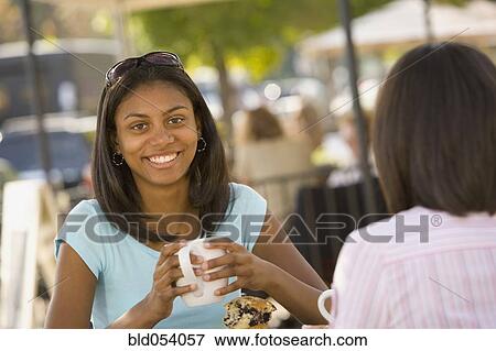 African teenaged girl holding coffee mug View Large Photo Image Stock Photo - African teenaged girl holding coffee mug. Fotosearch