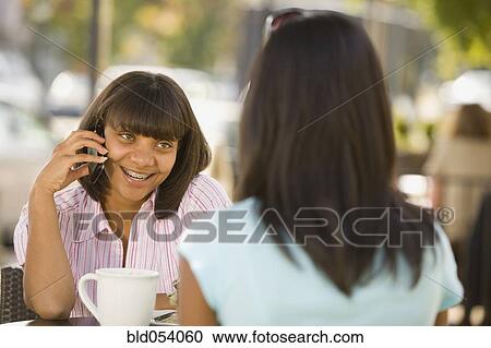 Stock Image - African teenaged girl talking on cell phone. Fotosearch