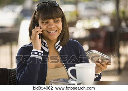 African teenaged girl talking on cell phone View Large Photo Image Stock Image - African teenaged girl talking on cell phone. Fotosearch