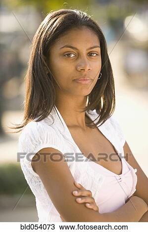 African teenaged girl with arms crossed View Large Photo Image Stock Image - African teenaged girl with arms crossed. Fotosearch
