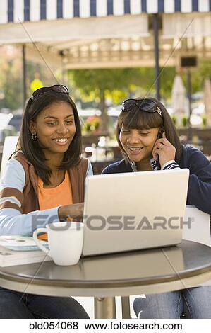 African teenaged girls looking at laptop View Large Photo Image Stock Photo - African teenaged girls looking at laptop. Fotosearch