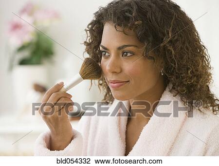 African woman applying makeup View Large Photo Image Stock Image - African woman applying makeup. Fotosearch
