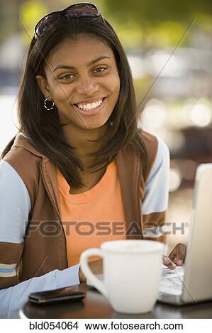 African woman at outdoor cafe View Large Photo Image Picture - African woman at outdoor cafe. Fotosearch