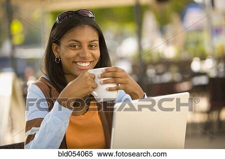 African woman drinking coffee View Large Photo Image Stock Photography - African woman drinking coffee. Fotosearch
