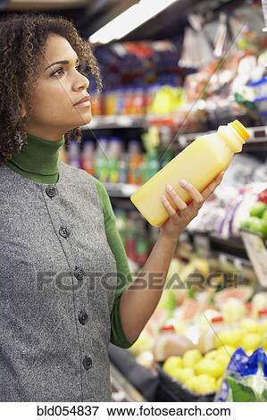 Stock Photo - African woman in grocery store. Fotosearch