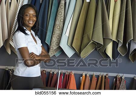 African woman next to fabric swatches View Large Photo Image Stock Photograph - African woman next to fabric swatches. Fotosearch
