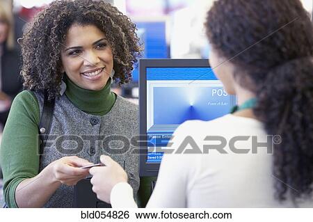 African woman paying with credit card View Large Photo Image Stock Photograph - African woman paying with credit card. Fotosearch