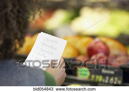 African woman reading grocery list View Large Photo Image Stock Image - African woman reading grocery list. Fotosearch