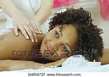 African woman receiving massage View Large Photo Image Stock Photo - African woman receiving massage. Fotosearch
