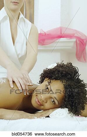 African woman receiving massage View Large Photo Image Stock Photograph - African woman receiving massage. Fotosearch